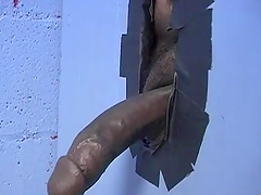 Blonde babe sucks a cock in a glory hole while she fingers her pussy