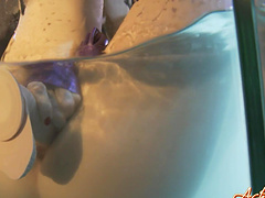 Blonde toys with pussy in aquarium tank