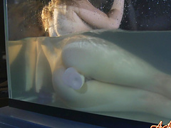 Blonde toys with pussy in aquarium tank