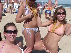 An outdoors beach party with pretty blondes in glasses