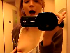 Amateur babe videos herself while stripping down in the bathroom