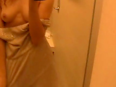 Amateur babe videos herself while stripping down in the bathroom