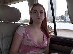 Seductive solo model with long hair masturbating in the car in a close up shoot