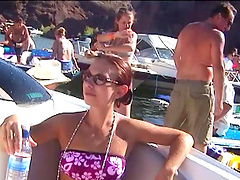 Spring Break boat party video with bikini babes floating on a lake