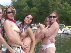 Bikini-clad chick with pretty natural tits dancing and having fun on a boat