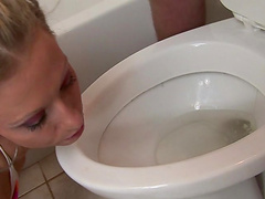 Seductive blonde babe with small tits giving an endearing blowjob in the toilet