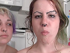 Kinky cowgirls with nose piercings  drinking piss in the kitchen