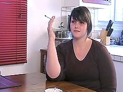 Chubby solo model flirts in the kitchen while enjoying a smoke