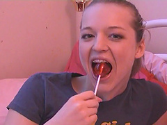 Randy slut sucking lollipop before toy fucking her cunt