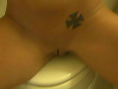 Slut on toilet with shaved pussy using toys on her holes giving handjob