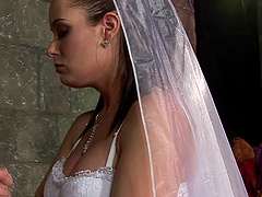 Tanya Cox, wearing wedding dress, gets fucked doggystyle