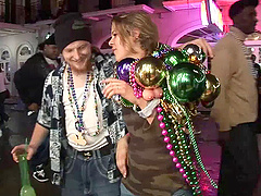 Randy slut flashing her nice tits at the mardi gras party