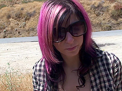 Sitting at a dusty rest stop Joanna Angel takes out her tits