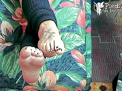 Lara shows off her tattooed feet and very cute toes