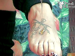 Lara shows off her tattooed feet and very cute toes