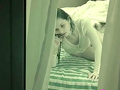 Hidden cam of  hot babe talking on the phone with no top on