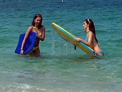 After a sweet moment at the beach,these lesbians rub their muffs in a scissors pose