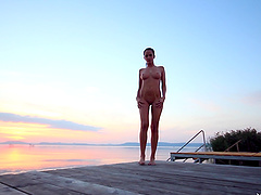 Beauty on the dock stripping lustily from her sexy bikini