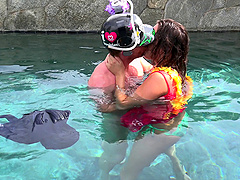 During a party this couple gets in the pool and fucks