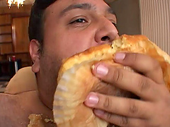 Fat guy eats while a cute blonde rides his pulsating love tool