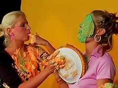 Girls make a mess of each other in this clothed sloppy scene