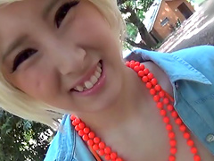 Blonde wig and an orange bikini on a curvy Asian slut