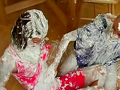 Cans of shaved cream emptied onto fully clothed ladies