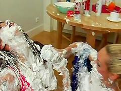 Cans of shaved cream emptied onto fully clothed ladies