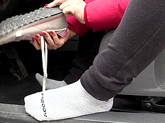 Alluring brunette pulls over to give her demanding feet a sensual touch in the car