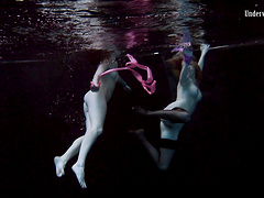 Sexy lesbian teen with her babe performing there teases underwater