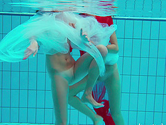 Redhead European lesbian teen getting cozy underwater