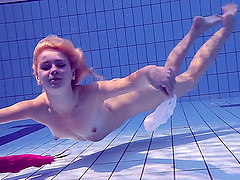 Russian babe Elena Proklova with small tits swimming naked