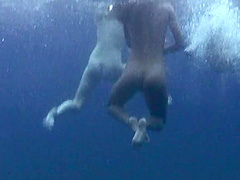 Wild girls swimming naked in the ocean while a friend films them