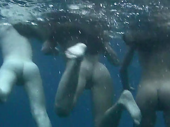 Wild girls swimming naked in the ocean while a friend films them