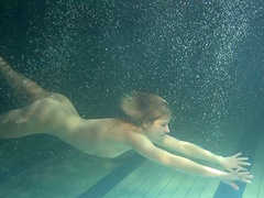 Small tits teen shading attire seductively under water