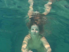 Small tits teen shading attire seductively under water