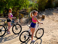 Karla Kush riding a bike with her lesbian babe and having sex