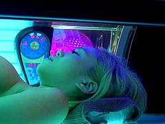 Blonde Asian chick with big tits ride a cock in a tanning salon