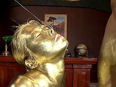 Stunning Japanese woman covered in gold paint plays with a dong