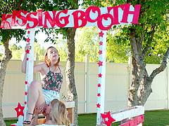 Ivy Wolfe licks Danni Rivers's pussy outdoors at the kissing booth