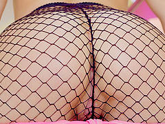 Provocative blonde Lindsey Cruz in fishnet stockings giving a BJ