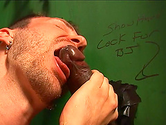 Gay guy enjoys sucking a fat black dick in the public bathroom