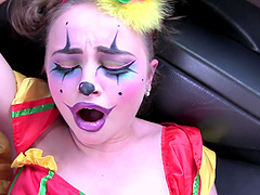 Kinky chick dressed as a clown enjoys riding a taxi driver's dick