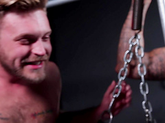 BDSM fetish video with a tattooed dude being tortured by his lover