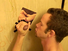 White man strokes his dick while blowing a stranger via gloryhole