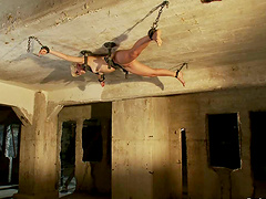 Blonde girl hangs on the ceiling and gets toyed