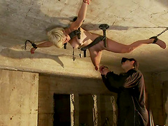 Blonde girl hangs on the ceiling and gets toyed