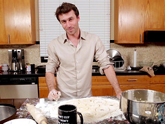 Video of two handsome guys preparing the lunch in a kitchen