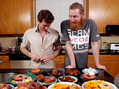 Video of two handsome guys preparing the lunch in a kitchen