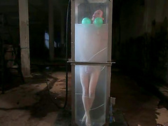 Horny Wenona gets sprayed and fucked by a machine before the immersion